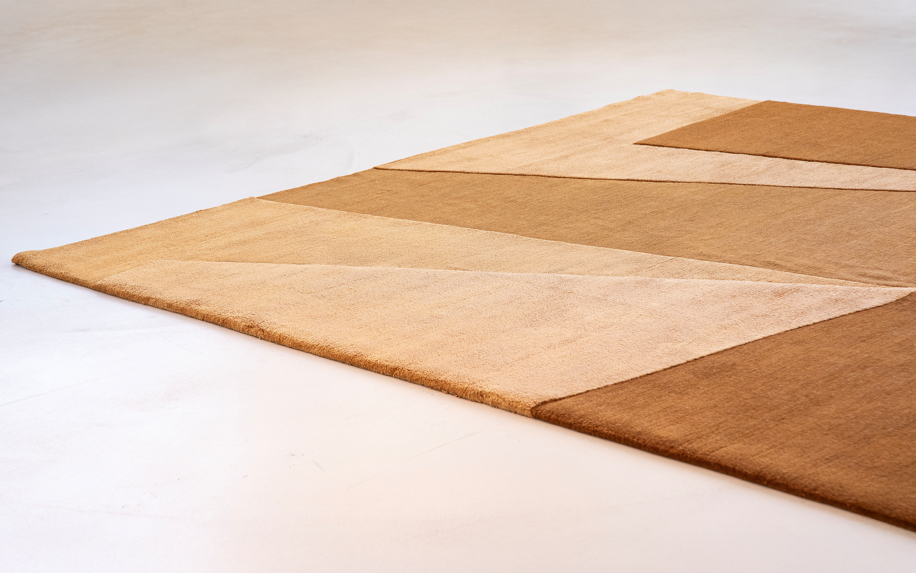 Pablo modern geometric area rug in warm neutral tones, handwoven in wool with abstract block patter